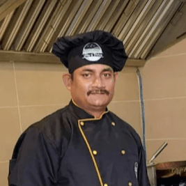 Portrait of Mr. Suman Bisht, VP of Procurement & Quality at Valley of Flavours.